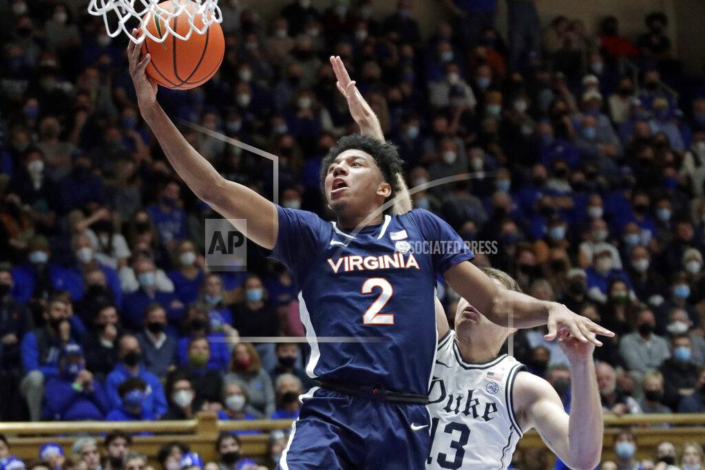 Chris Seward Virginia guard Reece Beekman (2) drives to the hoop past Duke forward Joey Baker (13) during the first half of an NCAA college basketball game, Monday, Feb. 7, 2022, in Durham, N.C. (AP Photo/Chris Seward)