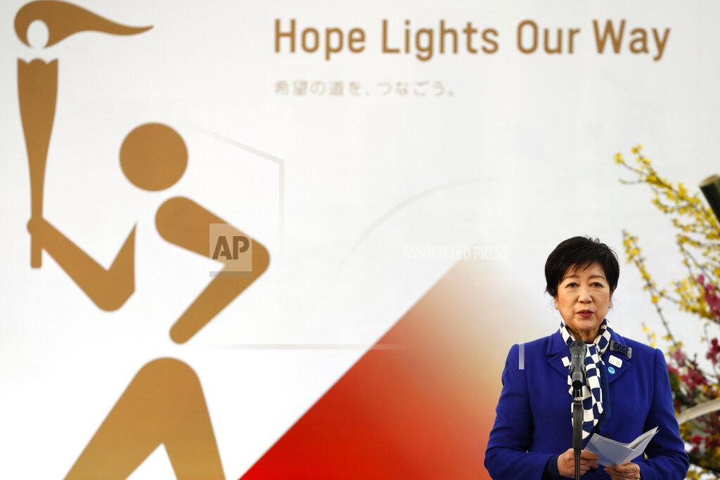 Kim Kyung-Hoon Tokyo Gov. Yuriko Koike delivers a speech during the Grand Start of the Olympic Torch Relay in Naraha, Fukushima prefecture, northeastern Japan, Thursday, March 25, 2021. The torch relay for the postponed Tokyo Olympics began its 121-day journey across Japan on Thursday and is headed toward the opening ceremony in Tokyo on July 23. (Kim Kyung-Hoon/Pool Photo via AP)