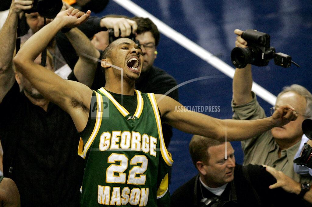 Susan Walsh FILE - In this Monday, March 26, 2006, file photo, George Mason's Lamar Butler (22) reacts after beating Connecticut 86-84 in overtime during the fourth round game of the NCAA basketball tournament in Washington. (AP Photo/Susan Walsh, File)