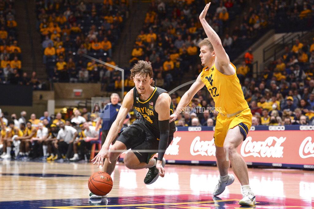 William Wotring Baylor guard Matthew Mayer (24) drives to the net while being guarded by West Virginia guard Sean McNeil (22) during the second half of an NCAA college basketball game in Morgantown, W.Va., Tuesday, Jan. 18, 2022. (William Wotring)
