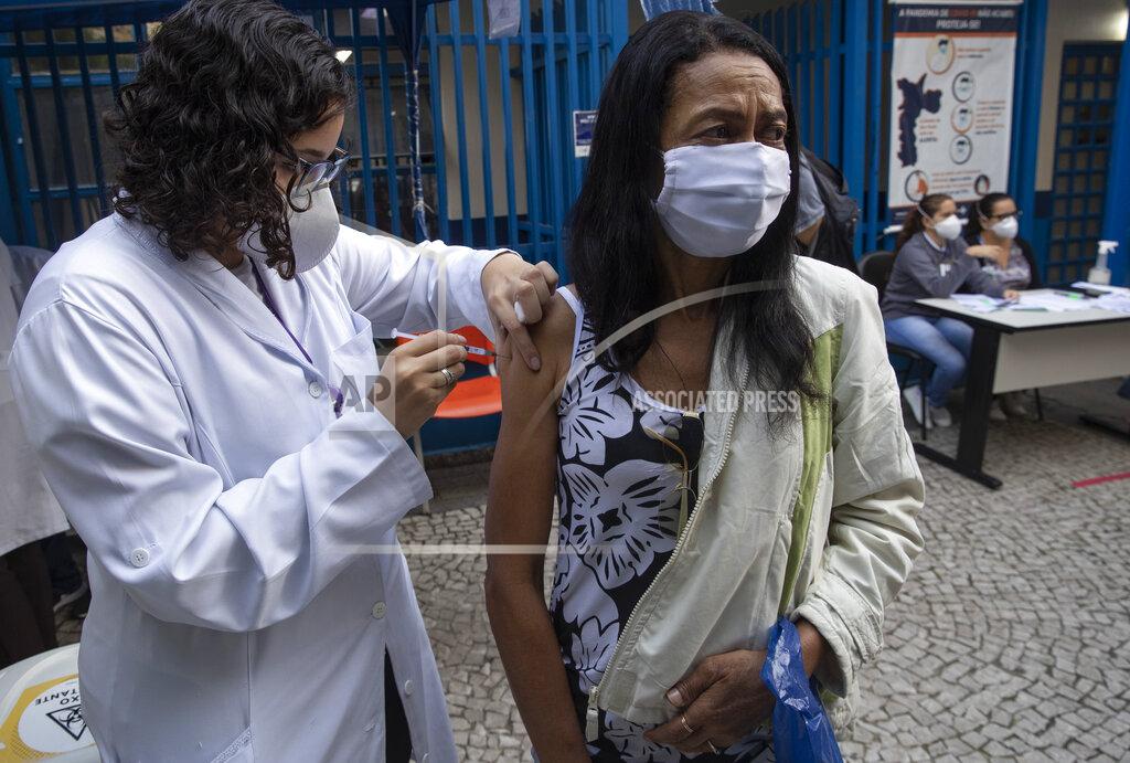 Andre Penner A health worker gives a shot of the Pfizer vaccine for COVID-19 at a community medical center in Sao Paulo, Brazil, Thursday, May 6, 2021. (AP Photo/Andre Penner)