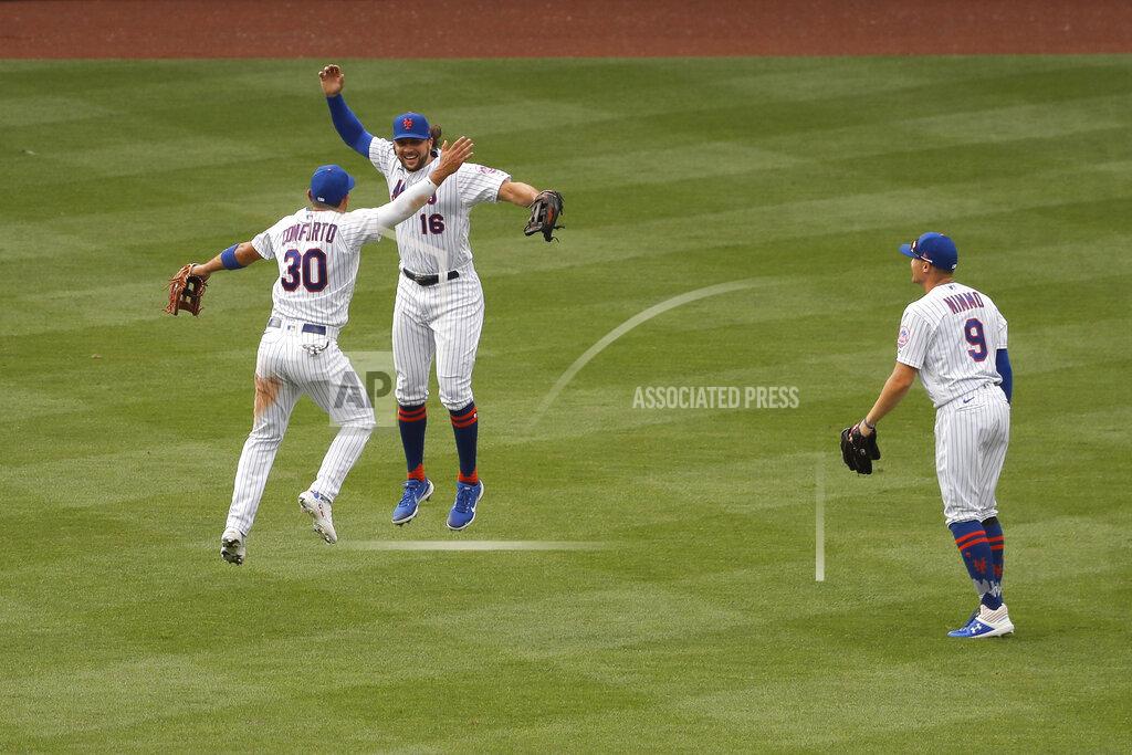 Seth Wenig New York Mets outfielders Michael Conforto, left, Jake Marisnick, center, and Brandon Nimmo react after a baseball game against the Atlanta Braves at Citi Field, Friday, July 24, 2020, in New York. (AP Photo/Seth Wenig)