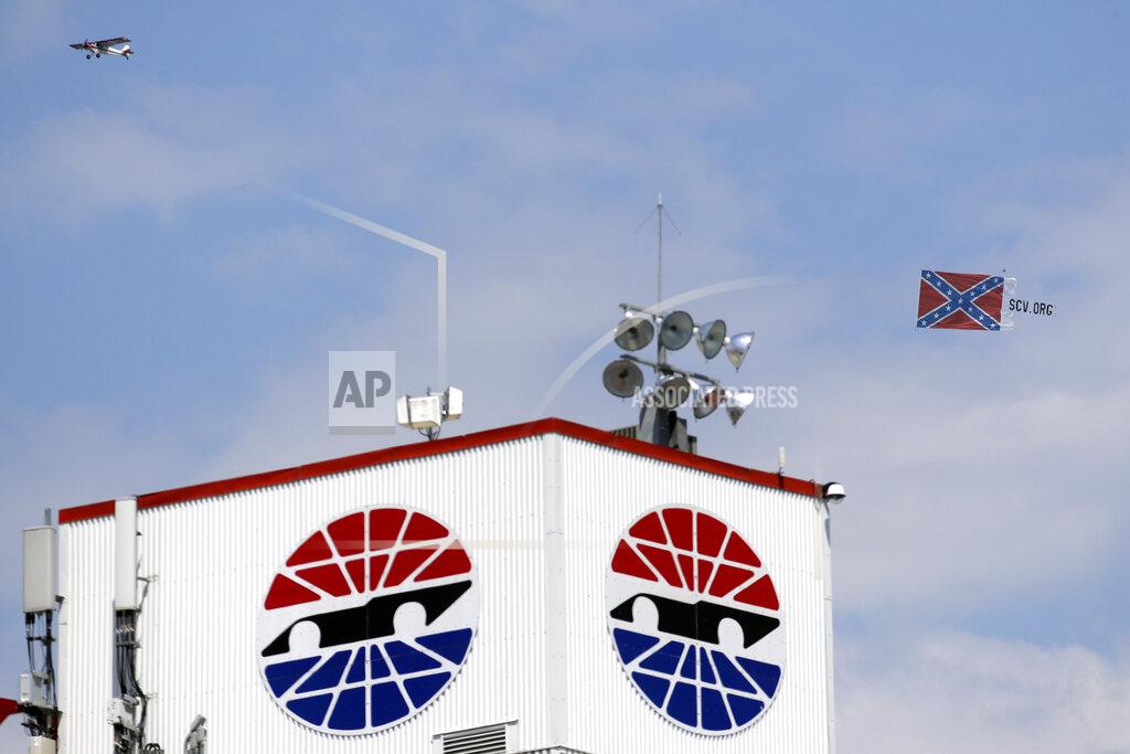 Mark Humphrey A plane pulls a Confederate battle flag over Bristol Motor Speedway before the NASCAR All-Star auto race in Bristol, Tenn, Wednesday, July 15, 2020. (AP Photo/Mark Humphrey)