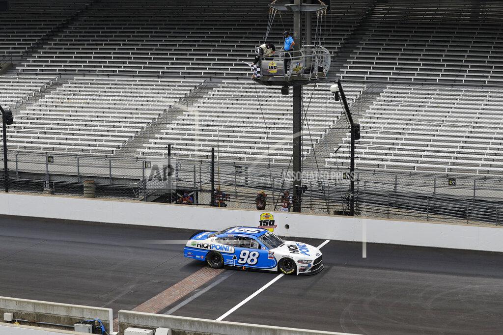 Darron Cummings NASCAR Xfinity Series driver Chase Briscoe takes the checked flag to win the NASCAR Xfinity Series auto race at Indianapolis Motor Speedway in Indianapolis, Saturday, July 4, 2020. (AP Photo/Darron Cummings)