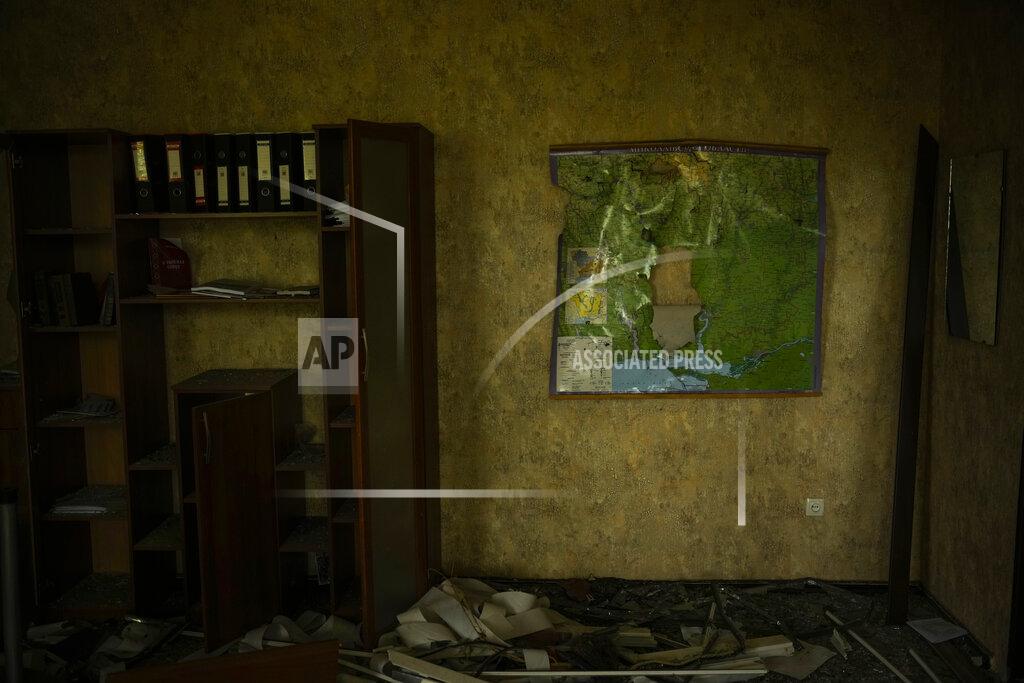 Francisco Seco A torn map of the region of Mykolaiv hangs on a wall in an office of the regional government headquarters of Mykolaiv, which was heavily damaged in a Russian attack, in Mykolaiv, Ukraine, Saturday, May 14, 2022. (AP Photo/Francisco Seco)
