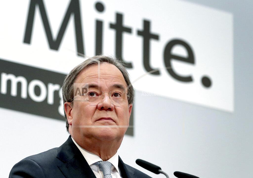 Michael Sohn FILE - In this Monday, Jan. 25, 2021 file photo Armin Laschet, chairman of the German Christian Democratic Union, CDU, attends a press conference at the party's headquarters in Berlin, Germany. Word on top reads 'Center'. Elections in two German states on Sunday pose a difficult test for Chancellor Angela Merkel's party, six months before a national vote that will determine who succeeds the country's longtime leader. (AP Photo/Michael Sohn, pool, file)