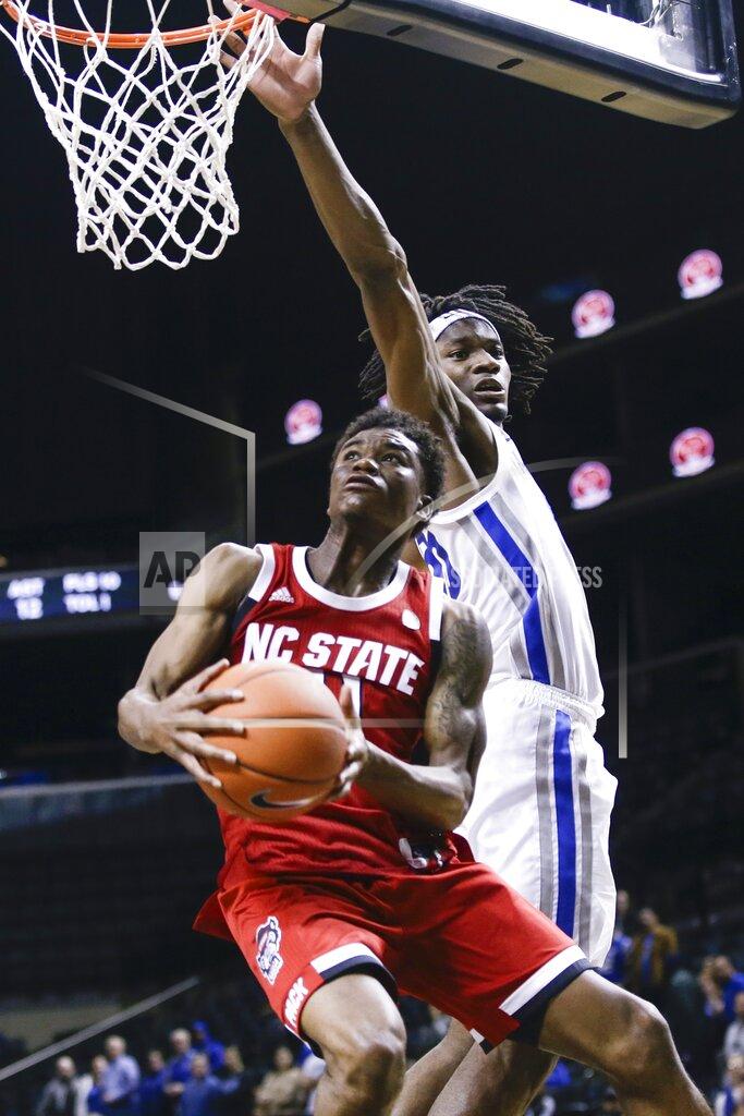 Frank Franklin Ii North Carolina State's Markell Johnson, left, drives past Memphis' Precious Achiuwa during the second half of an NCAA college basketball game in the Barclays Classic, Thursday, Nov. 28, 2019, in New York. (AP Photo/Frank Franklin II)