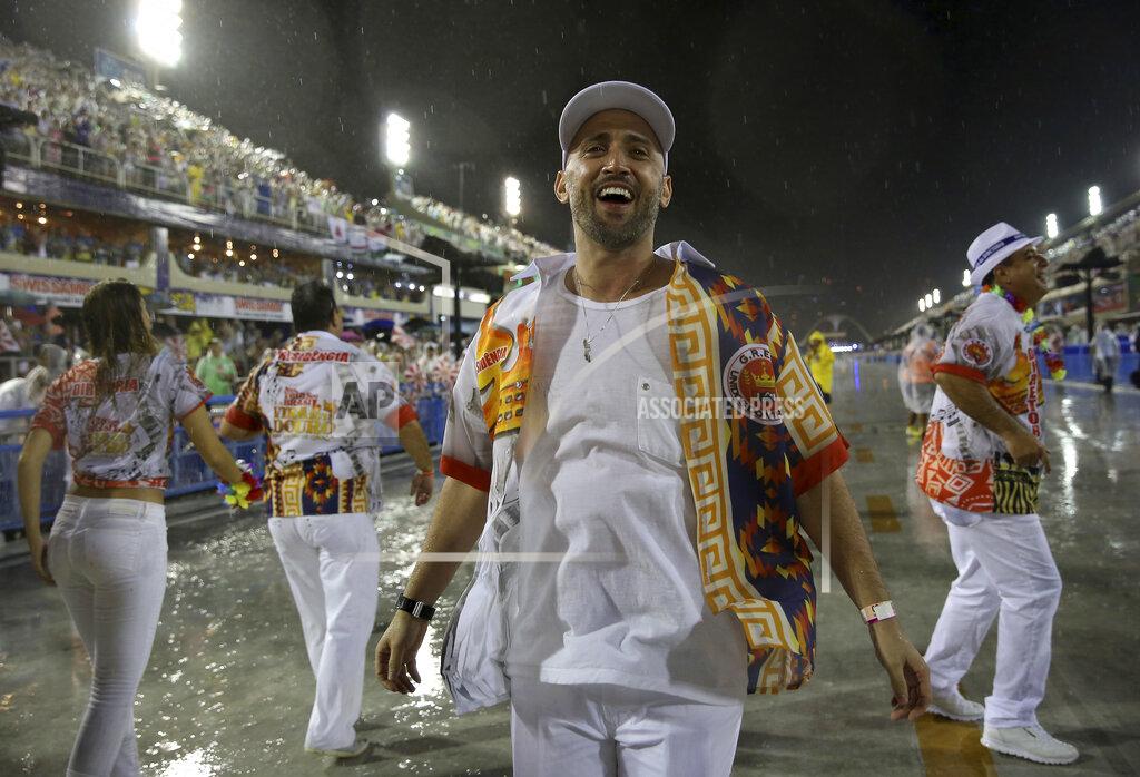 In this Feb. 15, 2015 photo, comedian and actor Paulo Gustavo participates in the Carnival parade at the Sambadrome in Rio de Janeiro, Brazil. The popular comedian died in a Rio hospital from complications related to COVID-19. He was 42. (AP Photo/Bruna Prado)