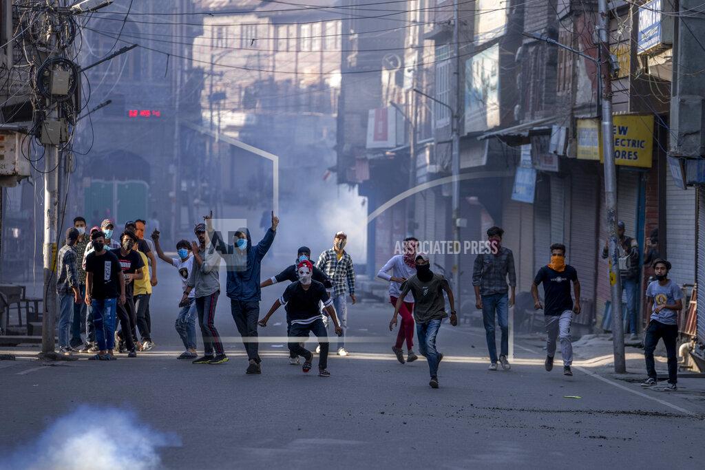 Dar Yasin Protesters clash with security forces during a protest against sentencing of Kashmiri separatist leader Yasin Malik, in Srinagar, Indian controlled Kashmir, Wednesday, May 25, 2022. An Indian court on Wednesday sentenced a Kashmiri separatist leader to life in prison after finding him guilty of terrorism and sedition, triggering an anti-India protest and partial shutdown of businesses in the Indian-controlled portion of disputed Kashmir. (AP Photo/Dar Yasin)