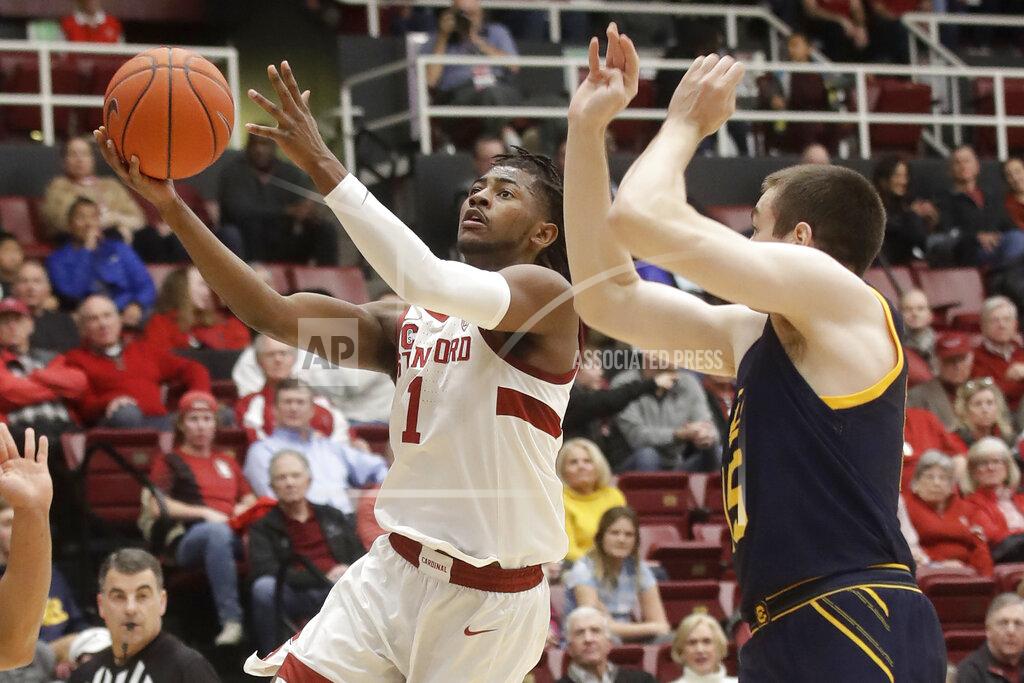 Jeff Chiu Stanford guard Daejon Davis (1) shoots next to California forward Grant Anticevich during the first half of an NCAA college basketball game in Stanford, Calif., Thursday, Jan. 2, 2020. (AP Photo/Jeff Chiu)