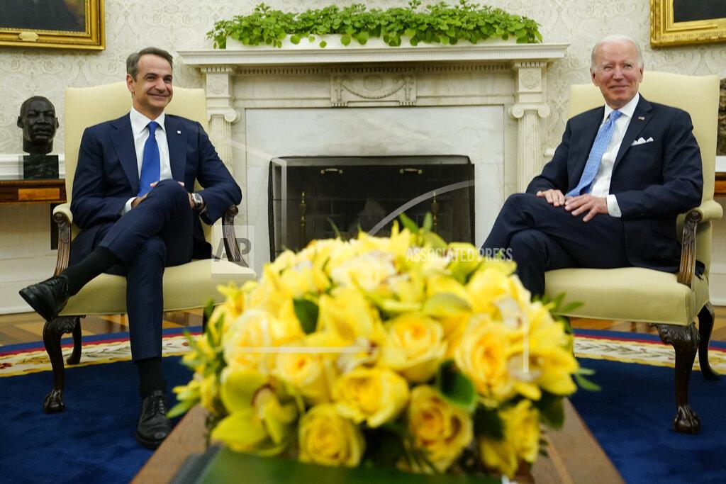 Susan Walsh President Joe Biden, right, and Greek Prime Minister Kyriakos Mitsotakis, left, meet in the Oval Office of the White House in Washington, Monday, May 16, 2022. (AP Photo/Susan Walsh)