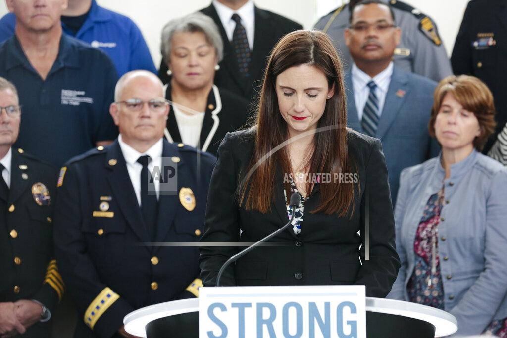Joshua A. Bickel FILE- In this Oct. 7, 2019 file photo, Whitney Austin, a survivor of the September 2018 mass shooting at the Fifth Third Center in Cincinnati, becomes emotional while recounting her experience during a news conference at the Ohio Department of Public Safety in Columbus, Ohio. Although Austin has made impressive gains in her recovery from 12 close-range gunshots, progress in the former bank executive's new life's mission of combatting gun violence has been slowed by the pandemic. (Joshua A. Bickel/The Columbus Dispatch via AP)