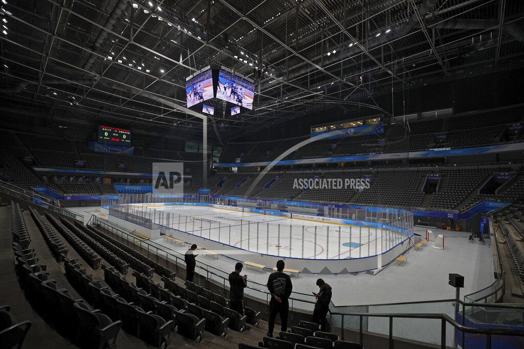 Andy Wong Volunteers and officials view the ice hockey venue for the 2022 Beijing Winter Olympics at the National Indoor Stadium in Beijing, Thursday, April 1, 2021. Chinese capital holds 10 days test events for 2022 Beijing Winter Olympics in five different venues from April 1-10 and becomes the first city to hold both the Winter and Summer Olympics. (AP Photo/Andy Wong)