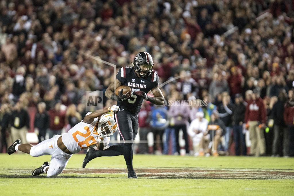 Sean Rayford South Carolina running back Rico Dowdle (5) runs with the ball against Tennessee defensive back Baylen Buchanan (28) during the first half of an NCAA college football game Saturday, Oct. 27, 2018, in Columbia, S.C. South Carolina defeated Tennessee 27-24. (AP Photo/Sean Rayford)