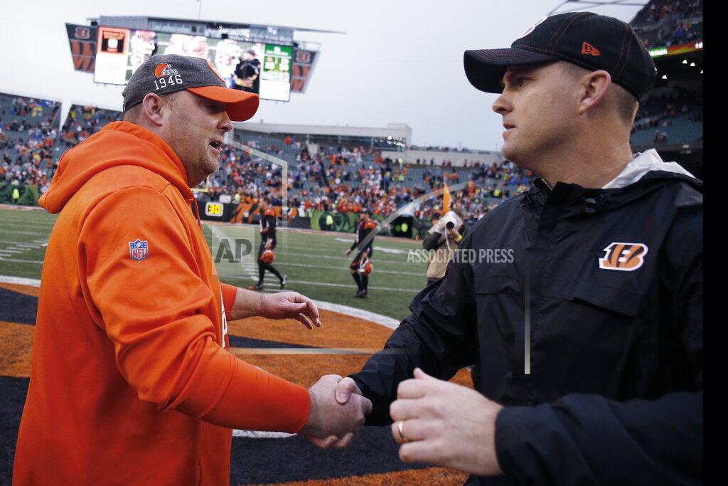 Cleveland Browns head coach Freddie Kitchens, left, congratulates Cincinnati Bengals head coach Zac Taylor after the Bengals defeated the Browns 33-23 in an NFL football game, Sunday, Dec. 29, 2019, in Cincinnati. (AP Photo/Gary Landers)