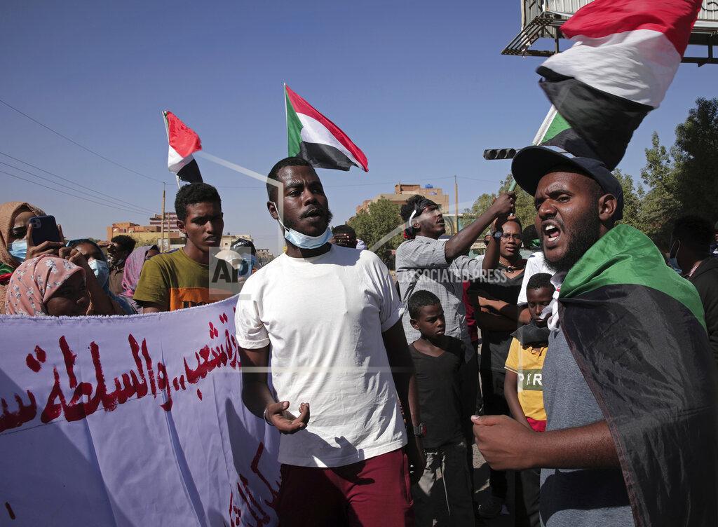 Marwan Ali Thousands of protesters take to the streets to renew their demand for a civilian government in the Sudanese capital Khartoum, Thursday, Nov. 25, 2021. The rallies came just days after the military signed a power-sharing deal with the prime minister, after releasing him from house arrest and reinstating him as head of government. The deal came almost a month after the generals orchestrated a coup. Sudan’s key pro-democracy groups and political parties have dismissed the deal as falling short of their demands for a fully civilian rule. (AP Photo/Marwan Ali)