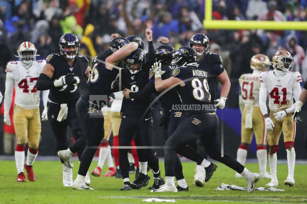 Julio Cortez Baltimore Ravens kicker Justin Tucker (9) is surrounded by teammates after kicking the winning field goal against the San Francisco 49ers in the second half of an NFL football game, Sunday, Dec. 1, 2019, in Baltimore, Md. Ravens won 20-17. (AP Photo/Julio Cortez)