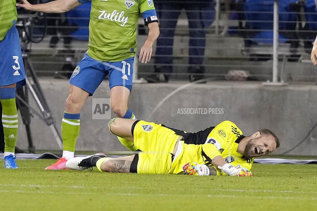 Tony Avelar Seattle Sounders goalkeeper Stefan Frei (24) grimaces after colliding with a San Jose Earthquakes player during the second half of an MLS soccer match Wednesday, May 12, 2021, in San Jose, Calif. The Sounders won 1-0. (AP Photo/Tony Avelar)