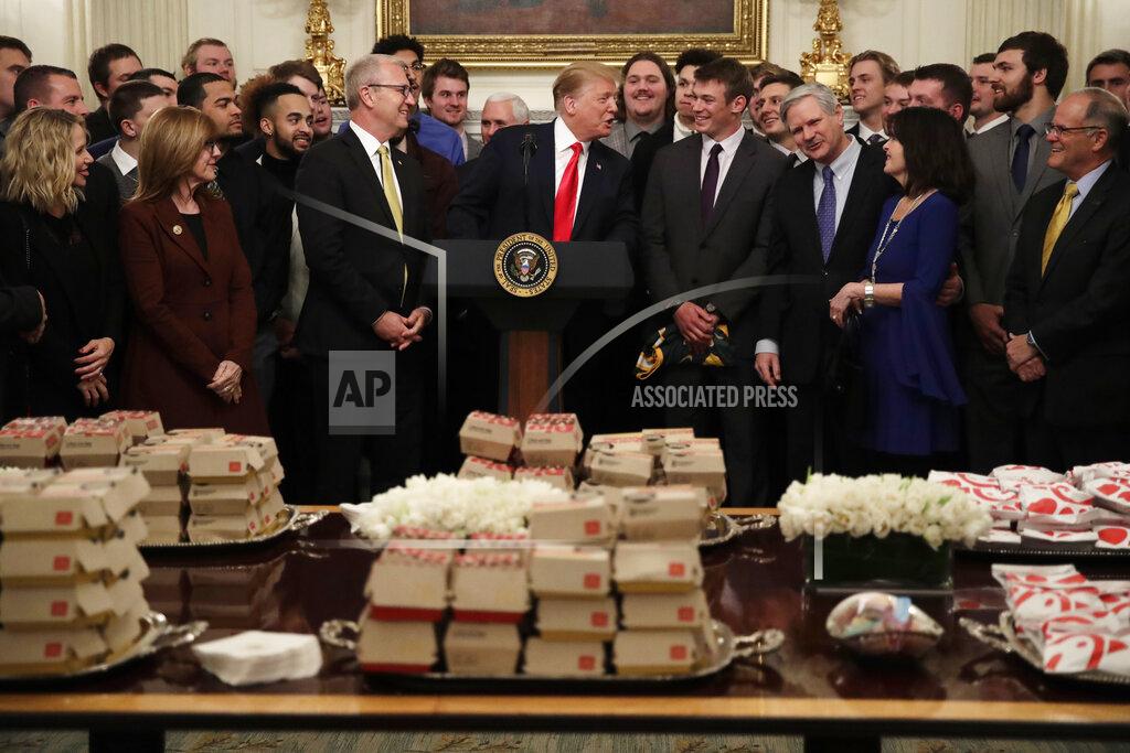 Carolyn Kaster President Donald Trump welcomes the 2018 NCAA FCS College Football Champions, The North Dakota State Bison, to the State Dining room of the White House in Washington, Monday, March 4, 2019, with McDonald's and Chick-fil-A fast food. Fourth from left is Sen. Kevin Cramer, R-N.D., third right is Sen. John Hoeven, R-N.D., and fourth from right is North Dakota State Bison quarterback Easton Stick. (AP Photo/Carolyn Kaster)