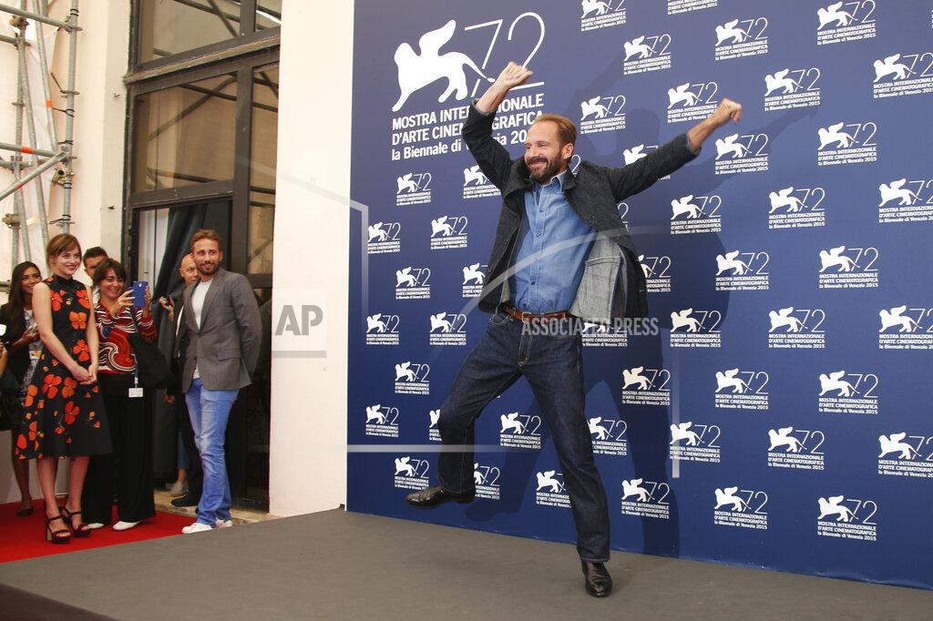 Joel Ryan File - Ralph Fiennes dances during a photo call for 'A Bigger Splash' at the Venice Film Festival. The 77th Venice Film Festival will kick off on Wednesday, Sept. 2, 2020, but this year's edition will be unlike any others. Coronavirus restrictions will mean fewer Hollywood stars, no crowds interacting with actors and other virus safeguards will be deployed. (Photo by Joel Ryan/Invision/AP, File)