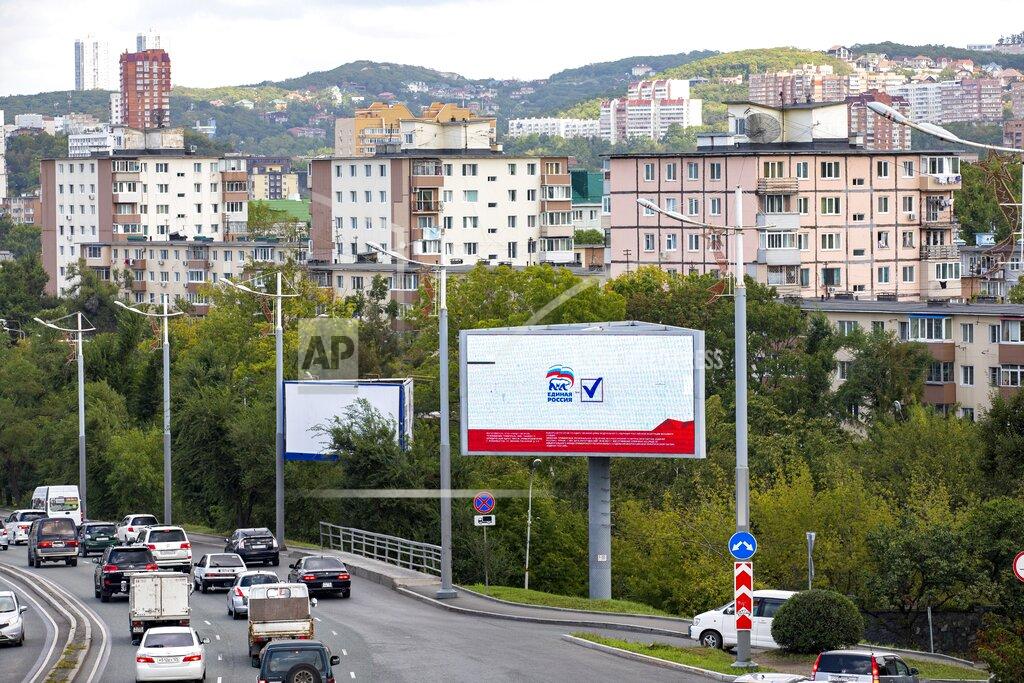 Alexander Khitrov An election billboard of the United Russia party calling for a vote is displayed in the far-eastern Russian port of Vladivostok, Russia, Thursday, Sept. 9, 2021. Russia is holding three days of voting this weekend for a new parliament that is unlikely to change the country’s political complexion. (AP Photo/Alexander Khitrov)