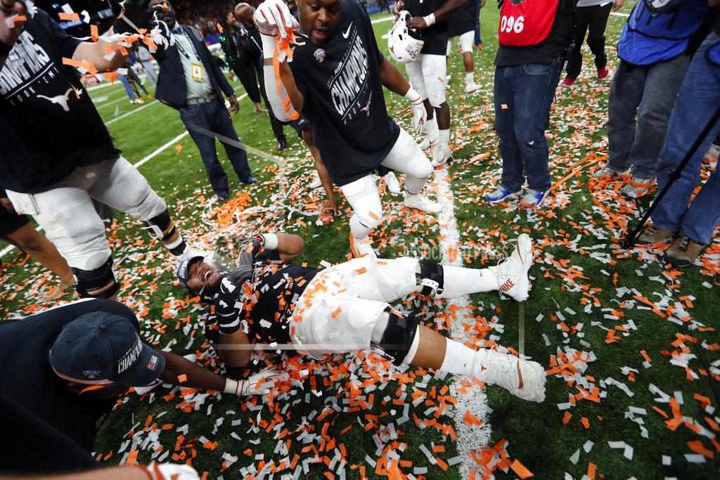 Gerald Herbert Texas players celebrate after defeating Georgia 28-21 in the Sugar Bowl NCAA college football game in New Orleans, Tuesday, Jan. 1, 2019. (AP Photo/Gerald Herbert)