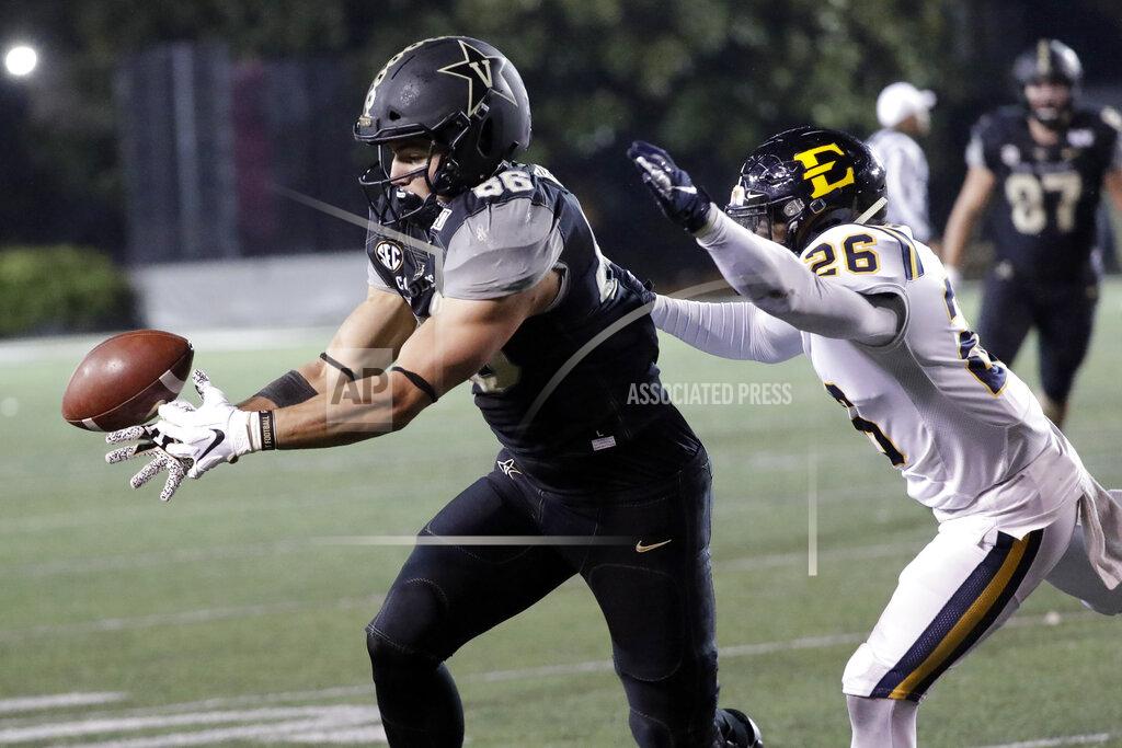 Mark Humphrey Vanderbilt tight end Ben Bresnahan (86) reaches for a pass as he is defended by ETSU defensive back Artevius Smith (26) in the second half of an NCAA college football game Saturday, Nov. 23, 2019, in Nashville, Tenn. Vanderbilt won 38-0. (AP Photo/Mark Humphrey)