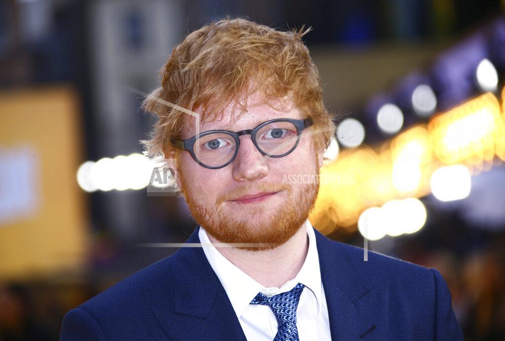 Joel C Ryan FILE - In this June 18, 2019, file photo, singer Ed Sheeran poses for photographers upon arrival at the premiere of the film "Yesterday'" in London. Sheeran will perform in a concert to kick off the NFL season opener in Florida next month. The NFL announced Friday, Aug. 6, that Sheeran will headline a pregame concert in Tampa, Fla. The British pop star's performance will take place before the reigning Super Bowl champion Tampa Bay Buccaneers face off against the Dallas Cowboys. (Photo by Joel C Ryan/Invision/AP, File)