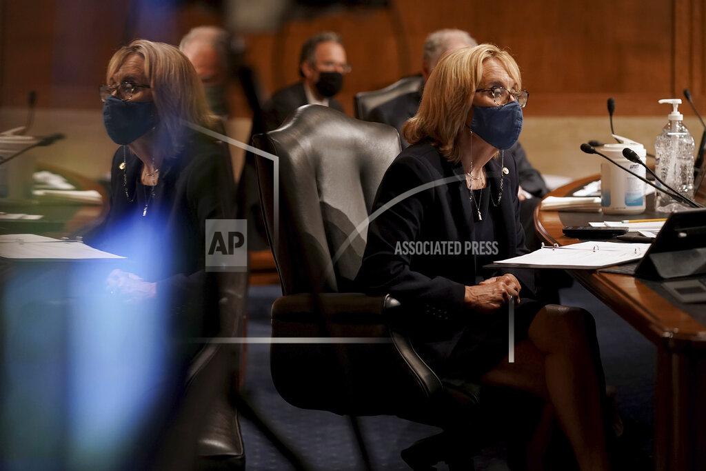 Greg Nash Sen. Maggie Hassan, D-N.H., listens to Surgeon General Jerome Adams give an opening statement during a Senate Health, Education, Labor and Pensions Committee hearing to discuss vaccines and protecting public health during the coronavirus pandemic on Capitol Hill, Wednesday, Sept. 9, 2020, in Washington. (Greg Nash/Pool via AP)