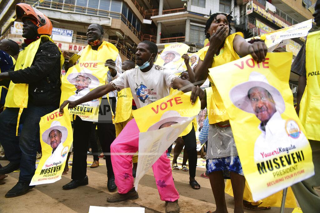 Nicholas Bamulanzeki Supporter of Ugandan President Yoweri Kaguta Museveni celebrate, in Kampala, Uganda, Saturday Jan. 16, 2021, after their candidate was declared winner of the presidential elections. Uganda’s electoral commission says longtime President Yoweri Museveni has won a sixth term, while top opposition challenger Bobi Wine alleges rigging and officials struggle to explain how polling results were compiled amid an internet blackout. In a generational clash widely watched across the African continent, the young singer-turned-lawmaker Wine posed arguably the greatest challenge yet to Museveni. (AP Photo/Nicholas Bamulanzeki)