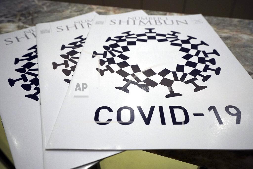 Eugene Hoshiko The cover design of Number 1 Shimbun is seen in Tokyo, Tuesday, May 19, 2020. Tokyo Olympics officials are incensed that their games emblem has been used in the cover design of the local magazine that combines the logo with the novel coronavirus. The “look-alike”emblem, which had “COVID-19” written underneath, was published on the cover the the April issue of the Foreign Correspondents Club of Japan's magazine. It also appeared in an online edition. (AP Photo/Eugene Hoshiko)