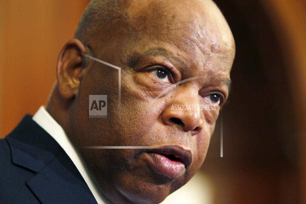 Carolyn Kaster FILE - This June 16, 2010 file photo, Rep. John Lewis, D-Ga., participates in a ceremony to unveil two plaques recognizing the contributions of enslaved African Americans in the construction of the United States Capitol on Capitol Hill in Washington. Six months after his death, the late civil rights leader and longtime Georgia congressman will retain a palpable influence in Congress. The state's two new Democratic U.S. senators are both personal friends and admirers of Lewis. (AP Photo/Carolyn Kaster, File)