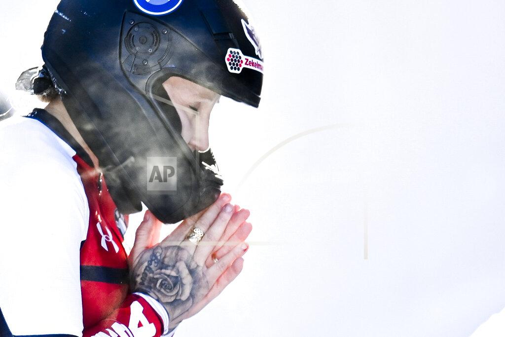 FILE - Kaillie Humphries of the United States reacts after the women's monobob World Series in St. Moritz, Switzerland, in this Saturday, Jan. 16, 2021. Humphries will seek a record fourth women’s bobsled world championship this weekend in Altenberg, Germany.(Gian Ehrenzeller/Keystone via AP, File)