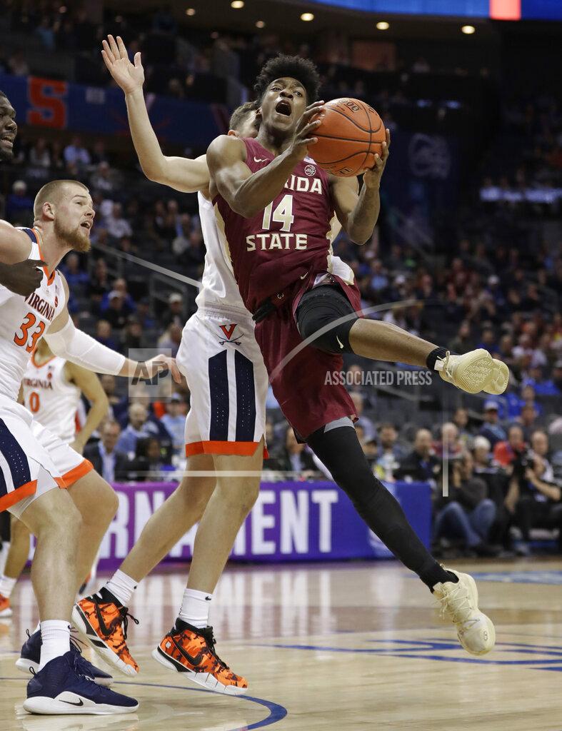 Nell Redmond Florida State's Terance Mann (14) is fouled as he drives against against Virginia during the first half of an NCAA college basketball game in the Atlantic Coast Conference tournament in Charlotte, N.C., Friday, March 15, 2019. (AP Photo/Nell Redmond)