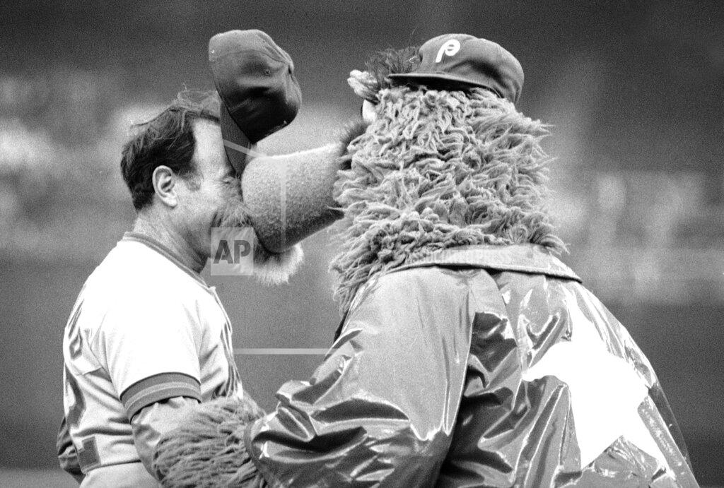 Rusty Kennedy FILE - New York Mets coach Joe Pignatano's cap stands on end as he is "kissed" by the Philadelphia Phillies mascot, the Philly Phanatic, before a baseball game in Philadelphia, June 4, 1981. Pignatano, who made his major league debut with the Brooklyn Dodgers in 1957 and later was a coach for the Mets, died Monday, May 23, 2022, in Naples, Fla. (AP Photo/Rusty Kennedy, File)