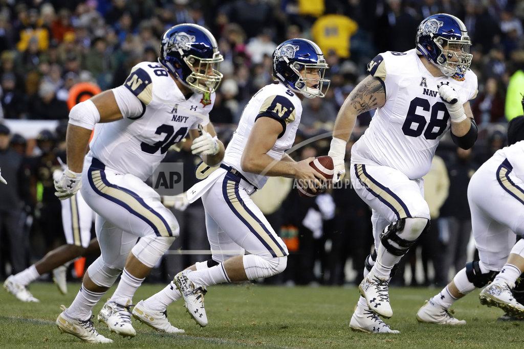 Matt Slocum Navy's Zach Abey, center, scrambles during the first half of an NCAA college football game against Army, Saturday, Dec. 8, 2018, in Philadelphia. (AP Photo/Matt Slocum)