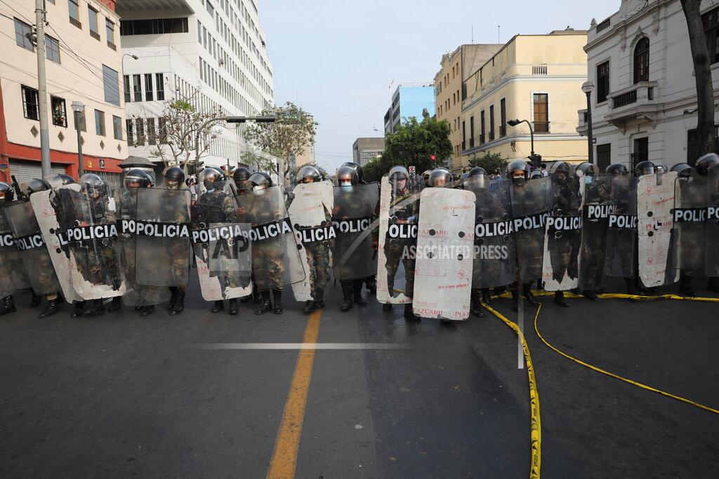 Rodrigo Abd Police form a cordon to prevent supporters of ousted President Martin Vizcarra from marching to Congress, in Lima, Peru, Wednesday, Nov. 11, 2020. On Tuesday, Peru swore in Manuel Merino as president, after Peru’s legislature booted Vizcarra from office on Monday. (AP Photo/Rodrigo Abd)
