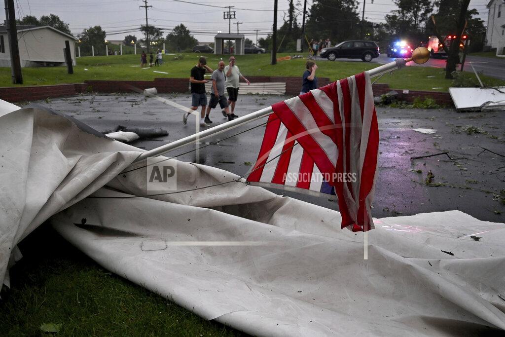 Tom Gralish Debris is scattered in the Penn Valley Terrace trailer park after a tornado hit in Trevose, Pa. Thursday, July 29, 2021. Five people were injured Thursday when a building at a Bensalem auto dealership was destroyed by severe weather, authorities said. The National Weather Service confirmed two tornados touched down in Bucks County, sending trees falling and debris flying.(Tom Gralish/The Philadelphia Inquirer via AP)
