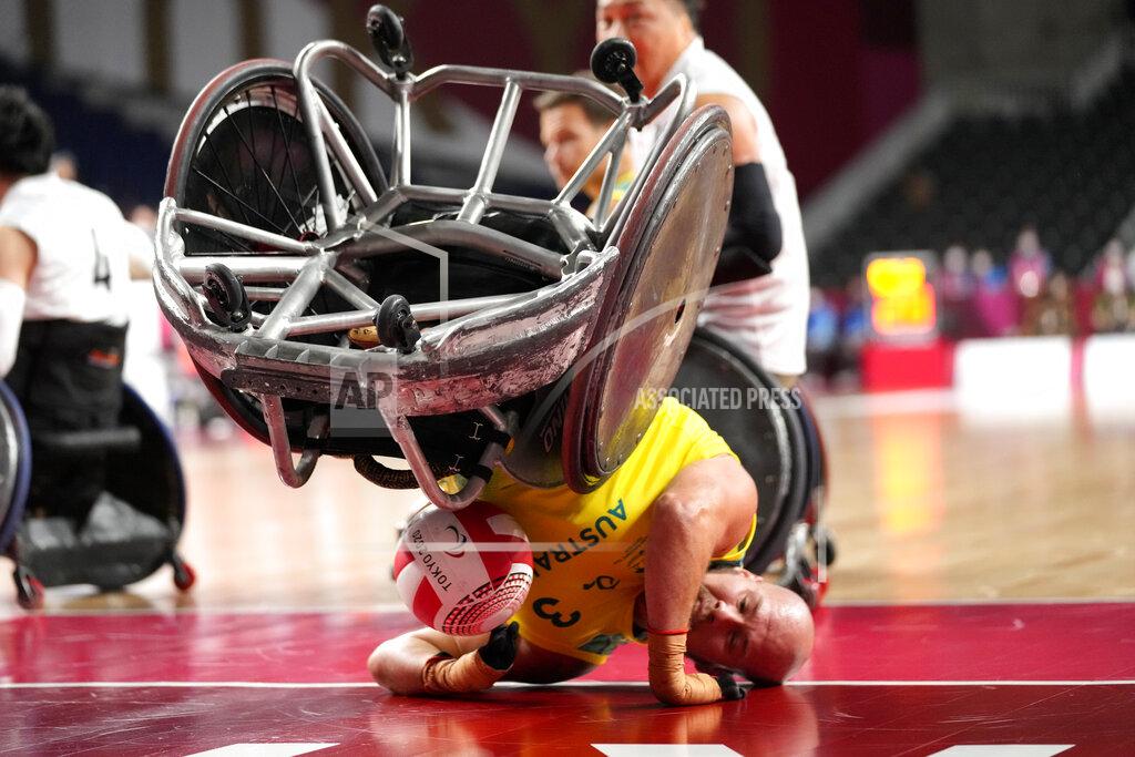 Shuji Kajiyama Australia's Ryley Batt falls during the wheelchair rugby bronze medal match against Japan at the Tokyo 2020 Paralympic Games, Sunday, Aug. 29, 2021, in Tokyo, Japan. (AP Photo/Shuji Kajiyama)