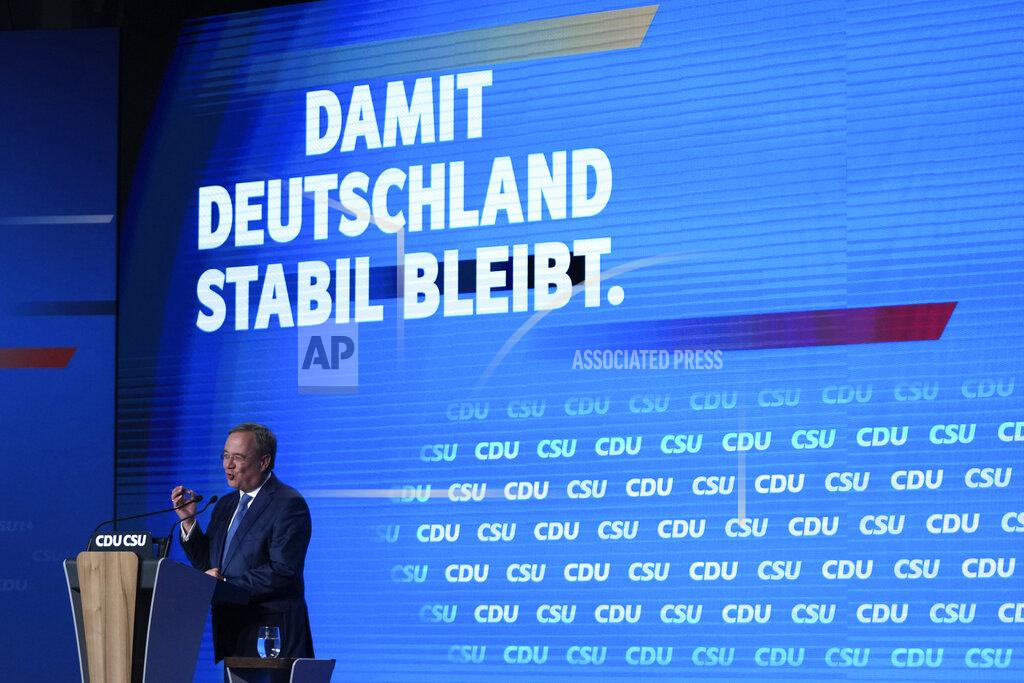 Matthias Schrader Christian Democrats chancellor candidate Armin Laschet gestures during his speech at a state election campaign in Munich, Germany, Friday, Sept. 24, 2021 two days before the General election on Sunday, Sept. 26, 2021. (AP Photo/Matthias Schrader)