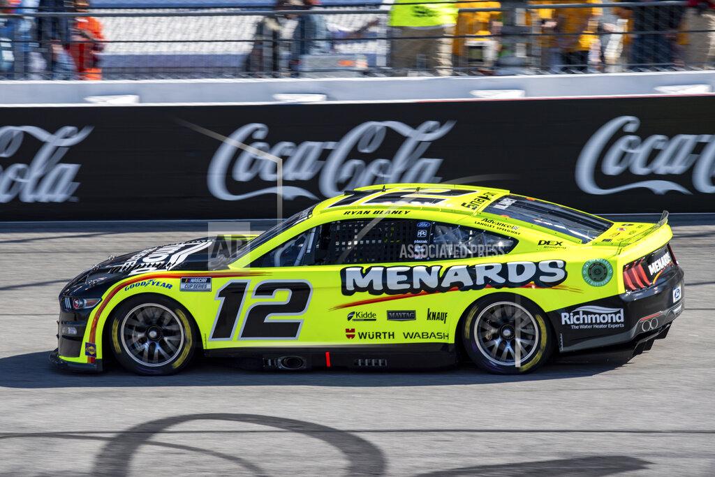 Mike Caudill Ryan Blaney (12) leads early in the NASCAR Cup Series auto race at Richmond Raceway on Sunday, April 3, 2022, in Richmond, Va. (AP Photo/Mike Caudill)