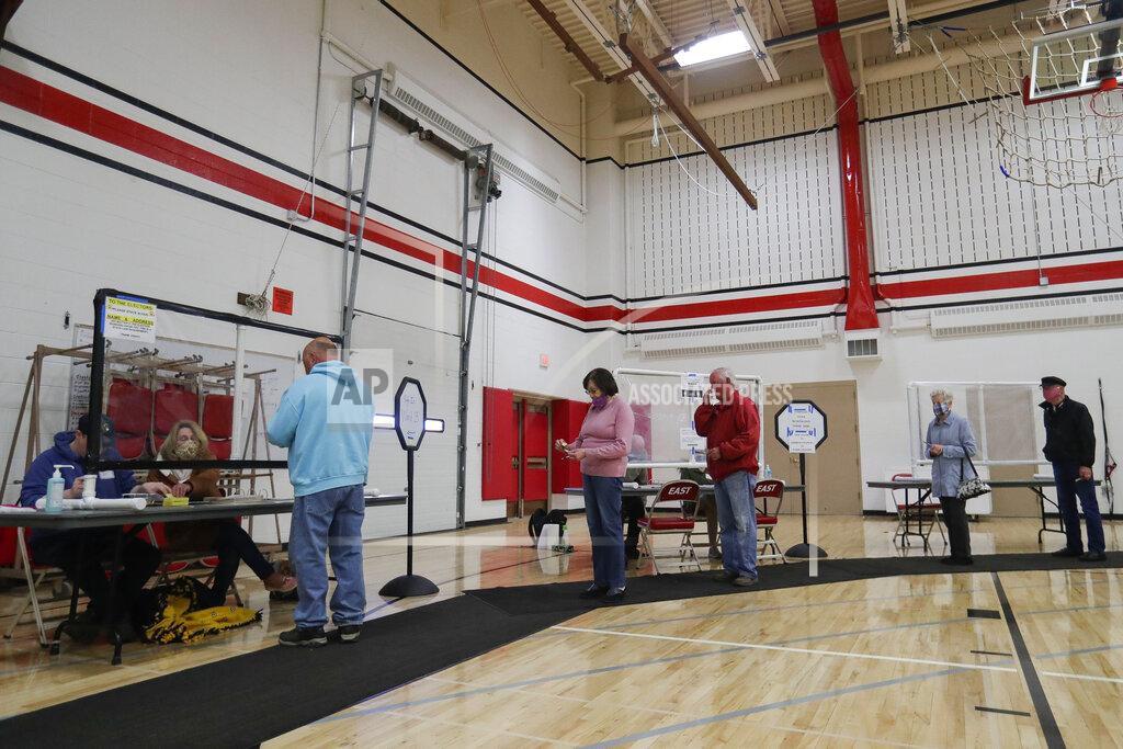 Tork Mason Voters wait in line to get checked in during a special election for Wisconsin's 7th Congressional District on Tuesday, May 12, 2020, at Wausau East High School in Wausau, Wis. Republican Tom Tiffany and Democrat Tricia Zunker are vying to fill the vacancy left by Republican Sean Duffy, who resigned from the seat in September. (Tork Mason/The Post-Crescent via AP)
