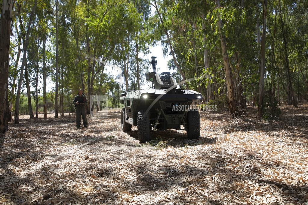 Sebastian Scheiner Israel Aerospace Industries' semi-autonomous four-wheel-drive "REX MKII" is seen at an IAI facility near the central Israeli city of Lod, Thursday, Sept. 9, 2021. Israel's state-owned Israel Aerospace Industries unveiled Monday a state-of-the-art unmanned vehicle their specialists said will be deployed alongside ground troops to assist in combat situations. (AP Photo/Sebastian Scheiner)