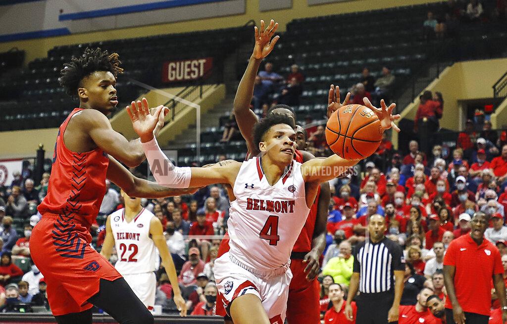 Jacob M. Langston Dayton forward Daron Holmes II, left, and Dayton Flyers guard Malachi Smith, right defends as Belmont guard Will Richard tries to grab a rebound during the first half of an NCAA college basketball game Sunday, Nov. 28, 2021, in Lake Buena Vista, Fla. (AP Photo/Jacob M. Langston)