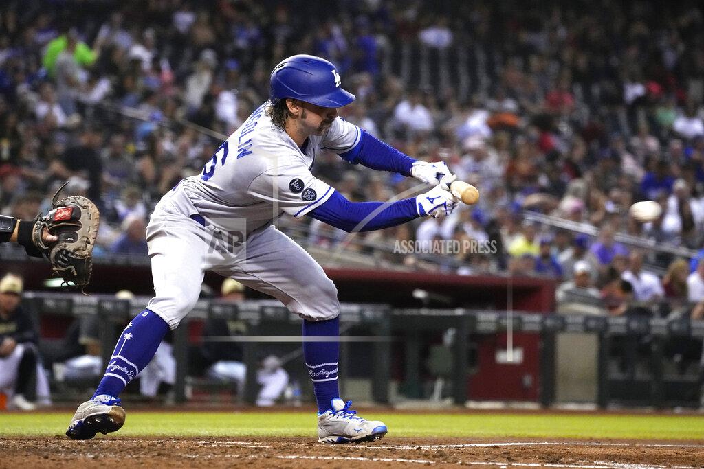 Rick Scuteri Los Angeles Dodgers' Tony Gonsolin lays down a sacrifice bunt against the Arizona Diamondbacks in the fifth inning during a baseball game, Friday, Sept. 24, 2021, in Phoenix. (AP Photo/Rick Scuteri)