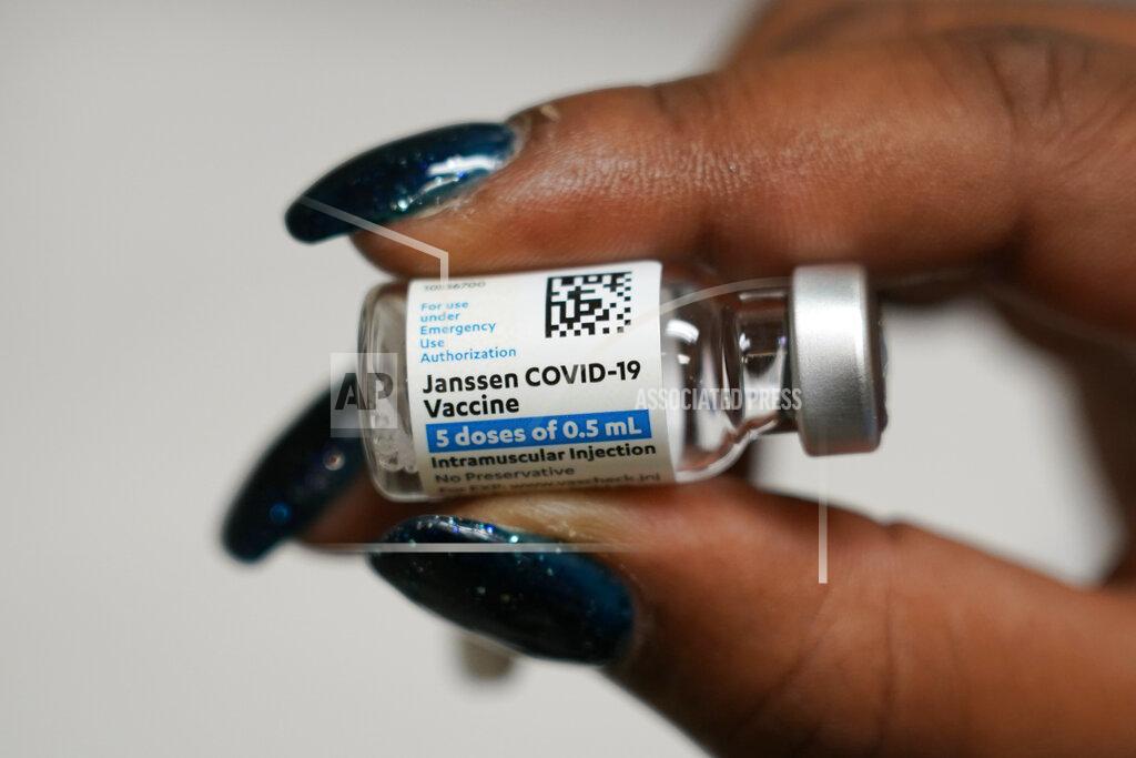Sharis Carr, a nurse at the Aaron E. Henry Community Health Service Center in Clarksdale, Miss., holds a vial of the Johnson & Johnson COVID-19 vaccine that was administered to seniors, Wednesday, April 7, 2021. The Mississippi Department of Human Services is in the initial stages of teaming up with community senior services statewide to help older residents get vaccinated. (AP Photo/Rogelio V. Solis)