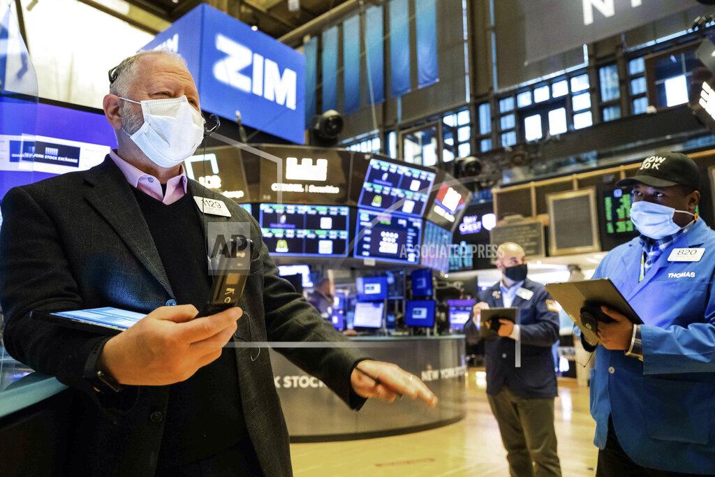 Colin Ziemer In this photo provided by the New York Stock Exchange, Robert Moran, left, works with fellow traders on the floor, Tuesday Feb. 2, 2021. Stocks were broadly higher in afternoon trading Tuesday, but shares of closely watched companies like GameStop and AMC Entertainment were falling sharply. (Colin Ziemer/New York Stock Exchange via AP)