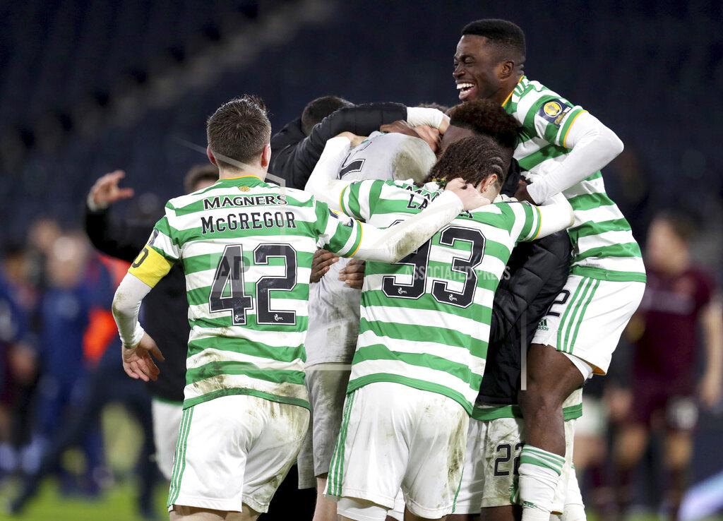 Andrew Milligan Celtic celebrate winning after the Scottish Cup Final soccer match between Celtic and Heart of Midlothian at Hampden Park, Glasgow, Scotland, Sunday, Dec. 20, 2020. (Andrew Milligan/PA via AP)