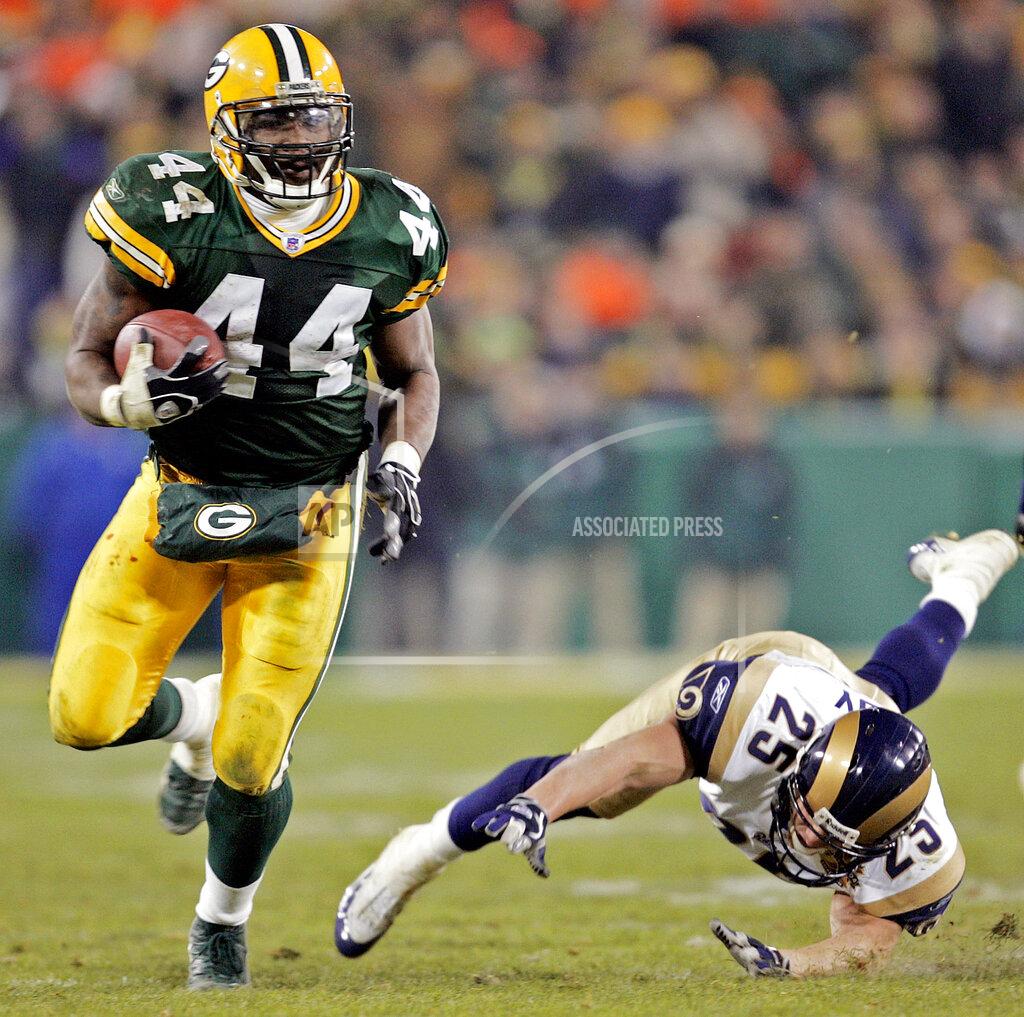 Morry Gash File-Green Bay Packers' Najeh Davenport breaks away from St. Louis Rams' Rich Coady (25) for a 40-yard touchdown run in the fourth quarter Monday, Nov. 29, 2004, in Green Bay, Wis. Dementia tests in the NFL concussion litigation allow doctors to use different baseline standards for Black and white retired players, making it more difficult for Blacks to show injury and qualify for awards, lawyers for two ex-players argued in court filings Tuesday, Aug. 25, 2020. Lawyers for ex-players Kevin Henry and Davenport said their clients were denied awards “based on a discriminatory testing regime" that weighs sociological factors including race. Both men would have qualified for awards had race not been considered, they said. (AP Photo/Morry Gash, File)