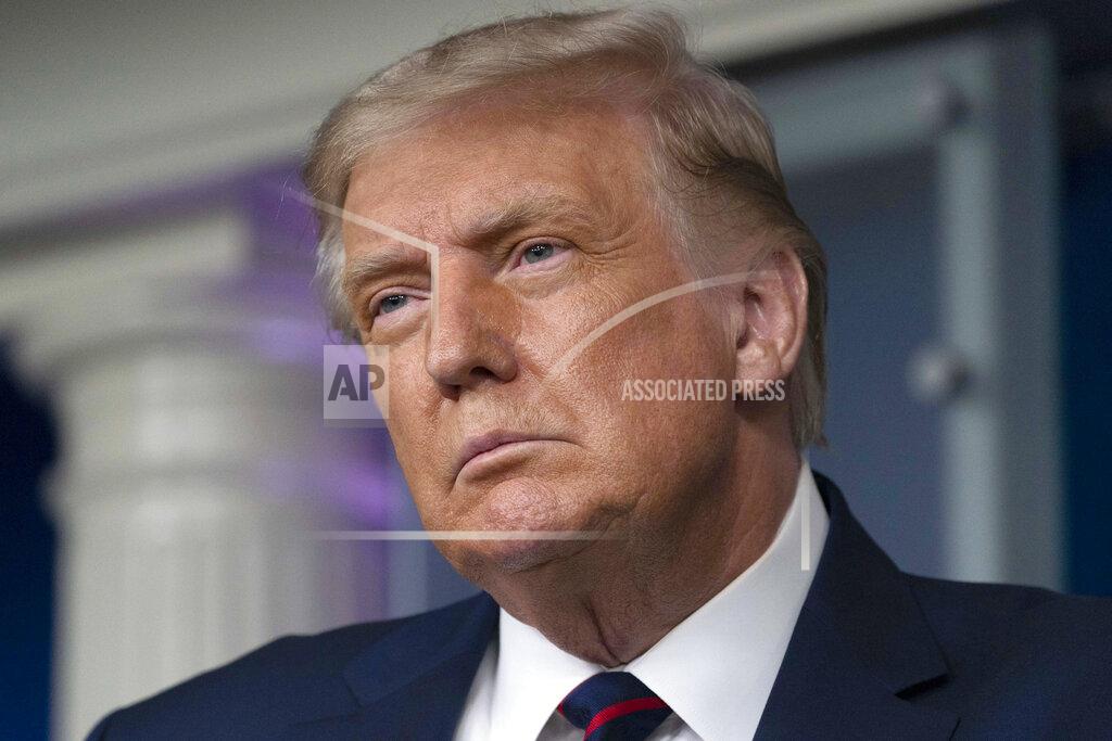 President Donald Trump pauses while speaking during a media briefing in the James Brady Briefing Room of the White House, Sunday, Aug. 23, 2020, in Washington.(AP Photo/Alex Brandon)
